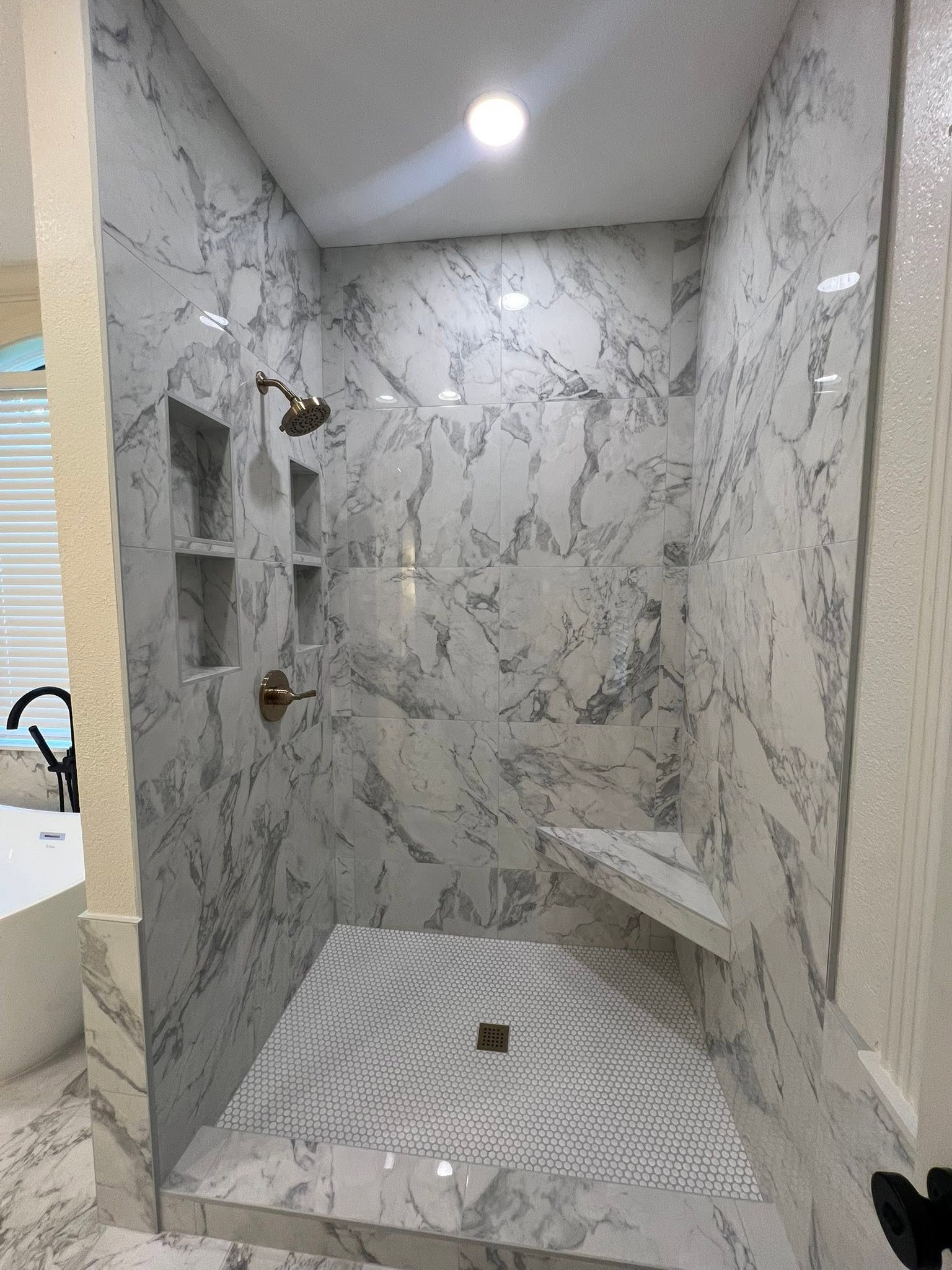 Finished bathroom and closet remodel by Mayfield Construction